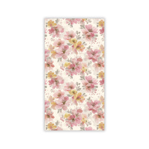 Floral patterned paper napkin with pink and yellow flowers on a white background