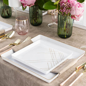 White and gold geometric design square plastic dinnerware set arranged on a table