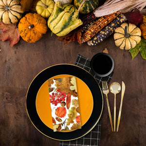 Thanksgiving table setting with pumpkins, gourds, and a patterned napkin on a wooden table | Posh Setting