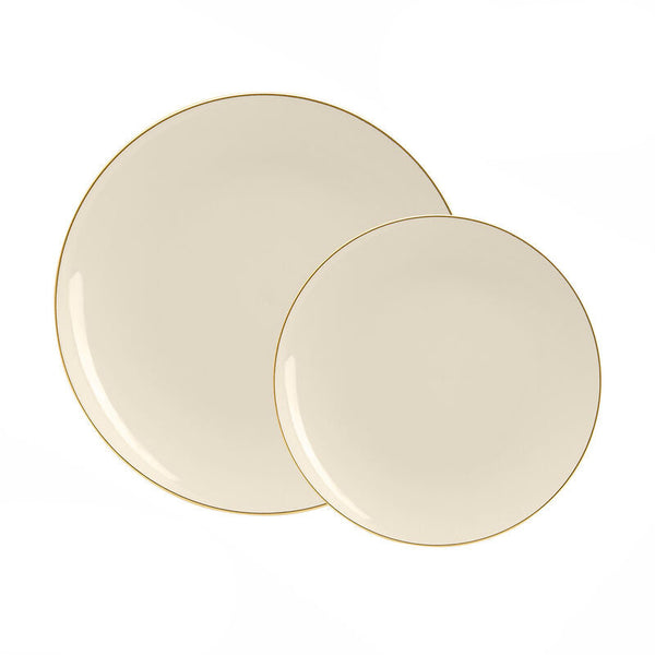 Two beige plates with gold rims on a white background