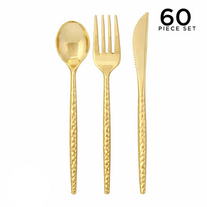Gold cutlery set with spoon, fork, and knife on a white background.