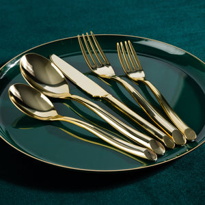 gold plastic dinnerware on a place setting