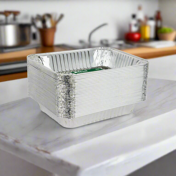 stack of aluminum foil pans on a kitchen counter