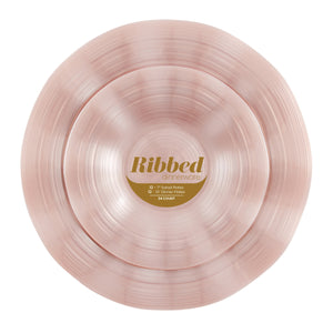 pearl pink ribbed plastic dinnerware set on a white background