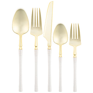 pearl and gold disposable flatware set on white background
