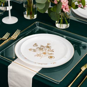 white and gold dinner plate set with french toile print on a green themed tablescape